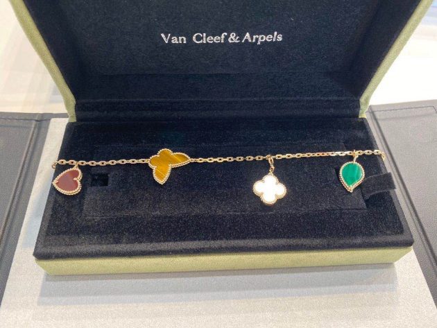 van cleef arpels lucky alhambra yellow gold bracelet 4 motifs mother of pearl malachite tiger eye carnelian 620865a4a065c