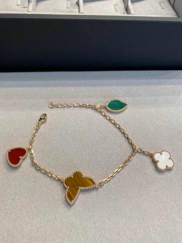 van cleef arpels lucky alhambra yellow gold bracelet 4 motifs mother of pearl malachite tiger eye carnelian 620865b8a909e